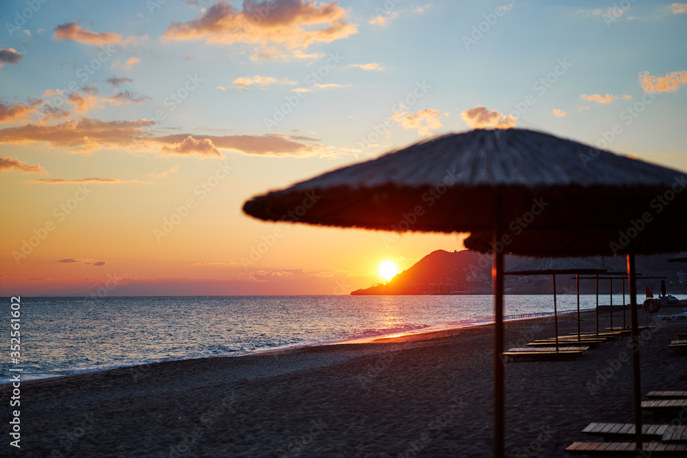 Beautiful landscape. Traveling by Turkey. Sea Beach with sunloungers and umbrellas. Beautiful landscape. Traveling by Turkey. Sea Beach with sunloungers and umbrellas.