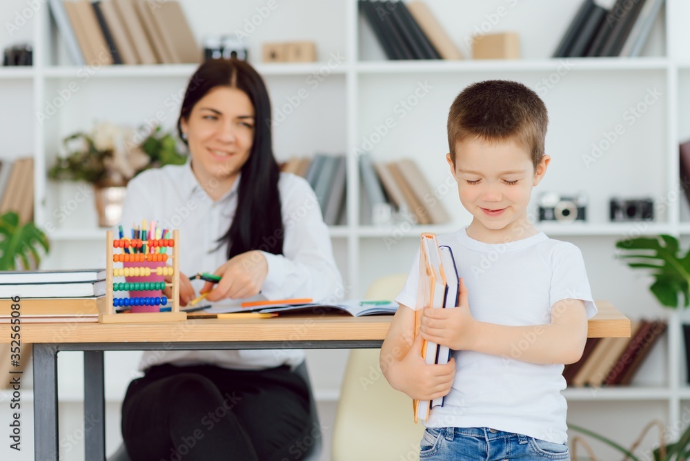 Tutor with pupil. Little girl studying. Private lesson. Tutor with pupil. Little girl studying. Private lesson.