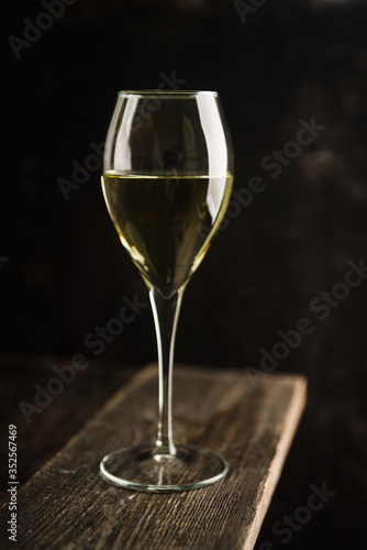 White wine on the rustic background. Selective focus. Shallow depth of field.
