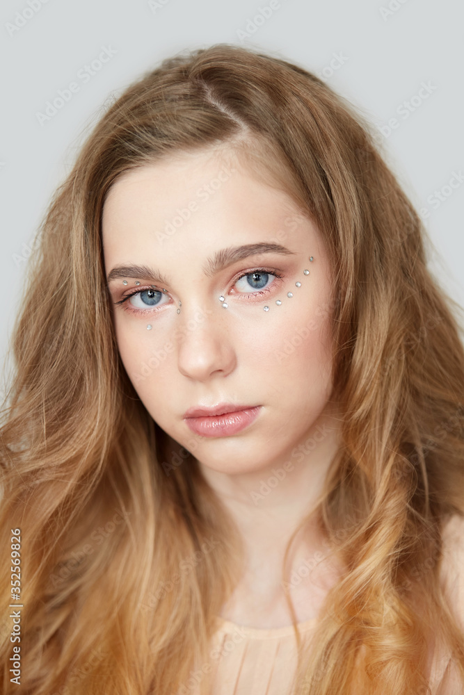 Naklejka premium Beauty and hair care. Beautiful woman with magnificent blond hair.