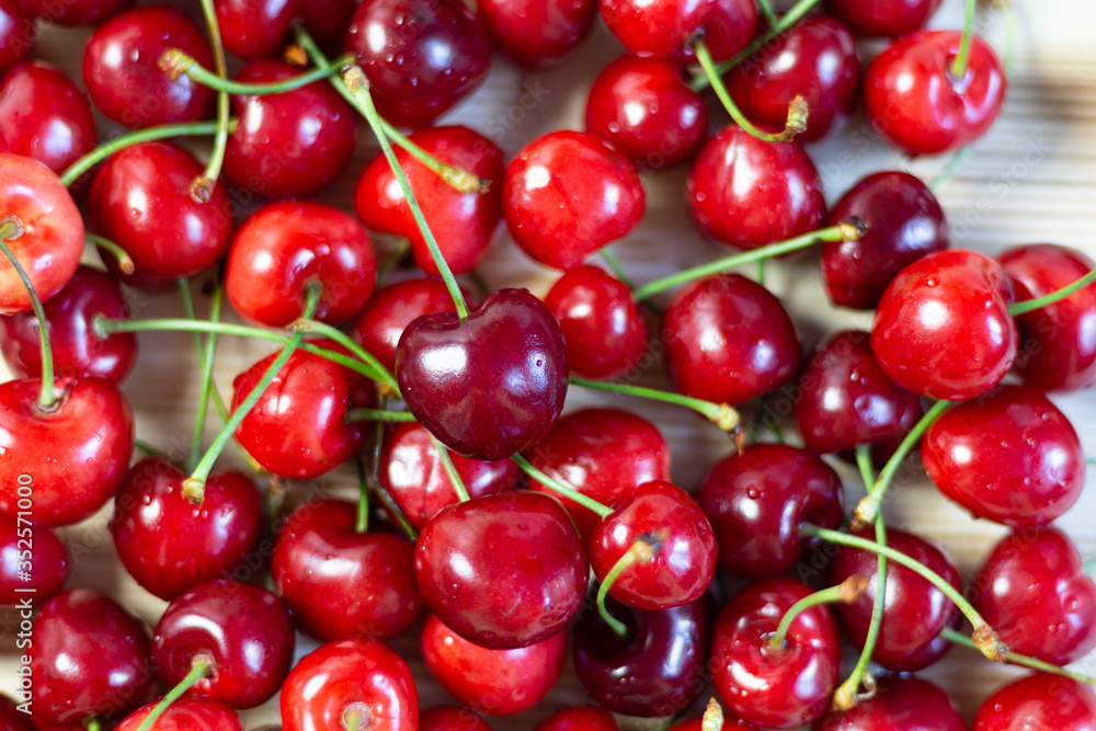 Ripe red cherry heap background close up Ripe red cherry heap background close up