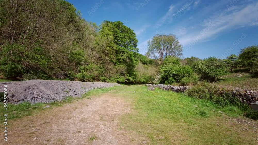 View of Cheddar Gorge in Somerset, England - a limestone gorge in the Mendip Hills, Cheddar, Somerset United Kingdom - 25th of May 2020 View of Cheddar Gorge in Somerset, England - a limestone gorge in the Mendip Hills, Cheddar, Somerset United Kingdom - 25th of May 2020
