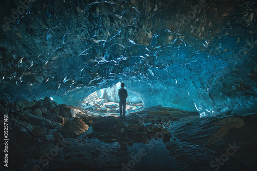 blue ice glacier cave grotto inside the mountain glacier Alibek, Dombay, Russia