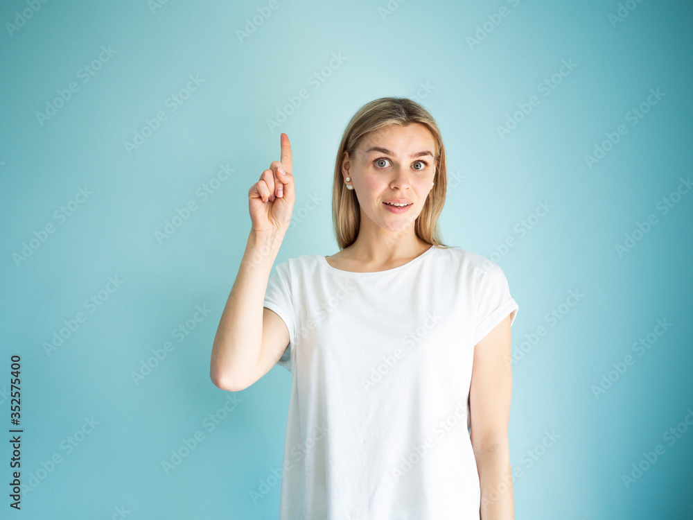I have idea emotion concept. Portrait of pretty woman with forefinger points up I have idea emotion concept. Portrait of pretty woman with forefinger points up