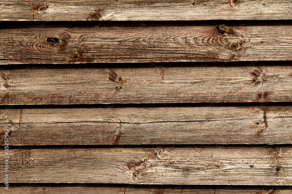 Old brown wooden wall background texture close up Old brown wooden wall background texture close up