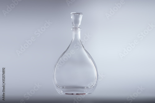 Bottle in the form of drops on a white background