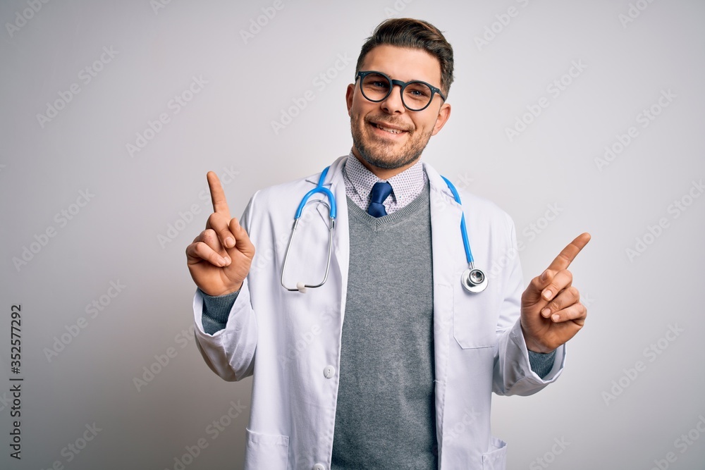 Young doctor man with blue eyes wearing medical coat and stethoscope over isolated background smiling confident pointing with fingers to different directions. Copy space for advertisement Young doctor man with blue eyes wearing medical coat and stethoscope over isolated background smiling confident pointing with fingers to different directions. Copy space for advertisement
