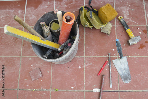 work tools leaning on the pavement ready to be used photo