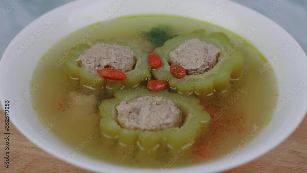 Thai food , bitter gourd soup with pork in a bowl Thai food , bitter gourd soup with pork in a bowl