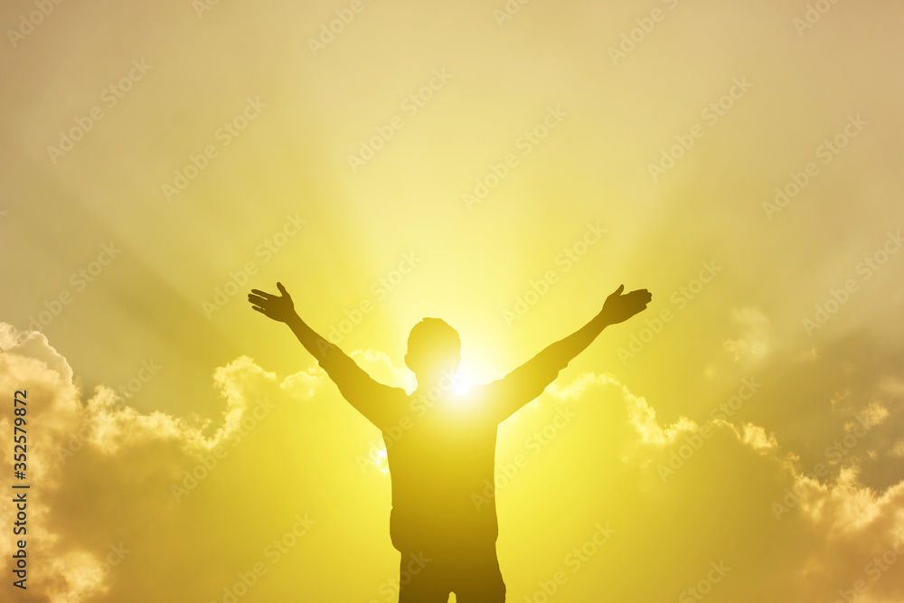 A man thanking God on the mountain A man thanking God on the mountain