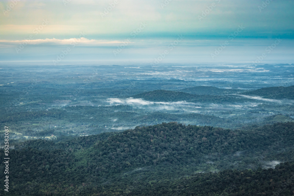 mountain horizon coverd with white mists and dense forests mountain horizon coverd with white mists and dense forests