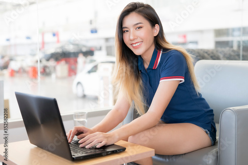 Asian women are doing online at the office.