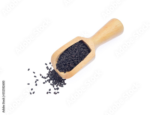 Wooden scoop with black sesame isoladed on white background. Package design element with clipping path