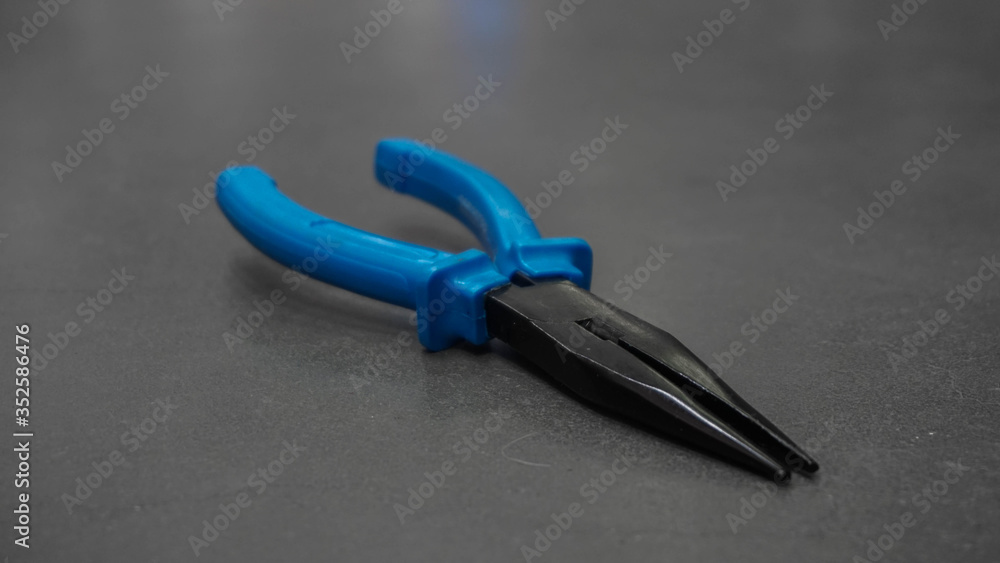 tool for male work, isolated blue pliers tool for male work, isolated blue pliers