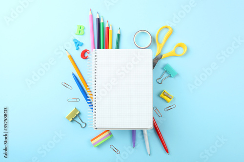 School office on a colored background top view. Office office, student office. Concept back to school. place for text. Flatlay 