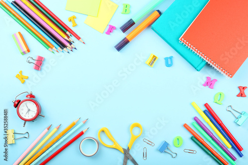 School office on a colored background top view. Office office, student office. Concept back to school. place for text. Flatlay 
