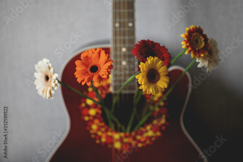 Wallpaper Mural Colorful flowers in a red guitar. Nature in music Torontodigital.ca