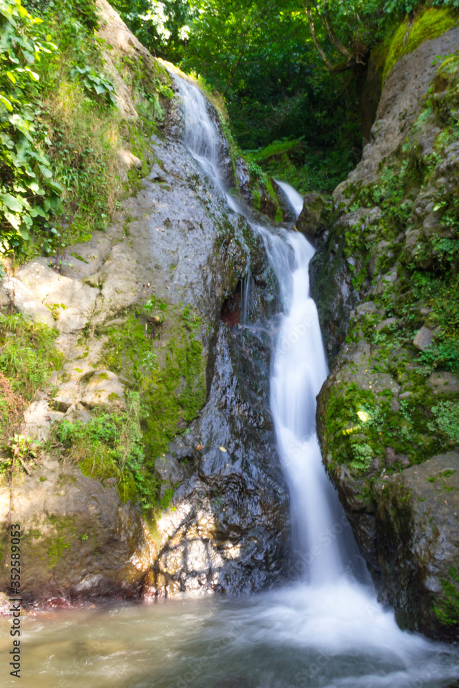 Fototapeta premium Waterfall of St. Andrew the First-Called. Not far from the village of Sarpi, on the border with Turkey. Vertical photo. Autonomous Republic of Adjara, Georgia, Eurasia.