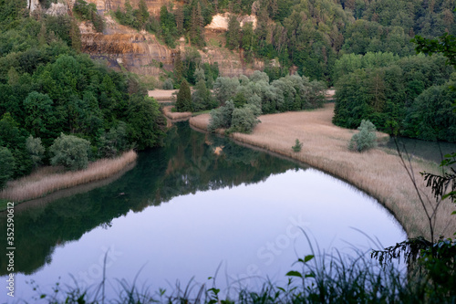 Calm water with reflections of nature