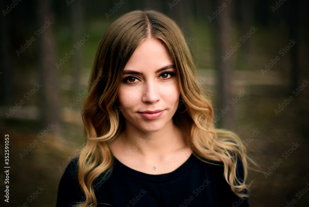 A beautiful young girl in fir tree forest A beautiful young girl in fir tree forest