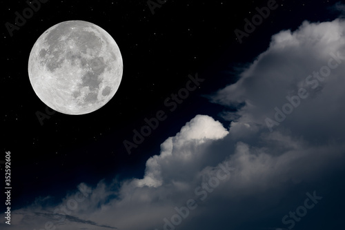 Full moon and big clouds in the night.