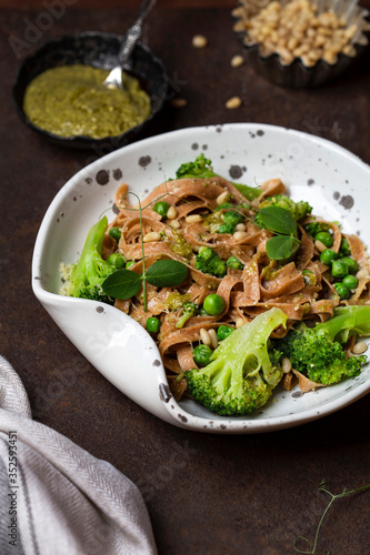 tagliatelle with pesto, green peas and broccoli