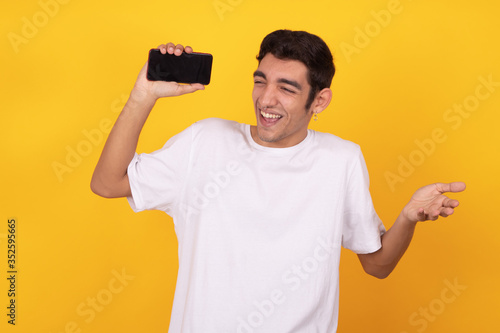 young male or teenager with mobile phone isolated