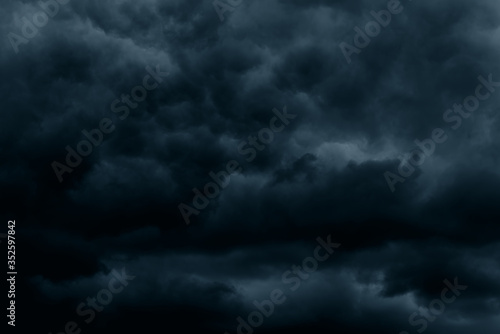 Stormy rain big fluffy clouds. Dark sky. Natural scenic abstract background. Weather changes backdrop. Sky filled with voluminous clouds. © Сyrustr