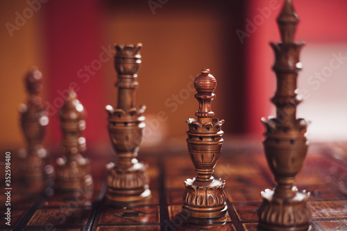 Handmade wooden chess on a lacquer board