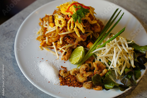 Pad Thai, Thai Style Fried Noodles with lemon, shrimp, nuts and bean sprouts