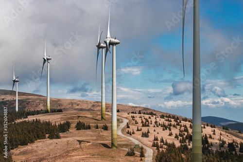 Wind turbines summer autumn landscape. Concept: Green power energy generation, wind farm