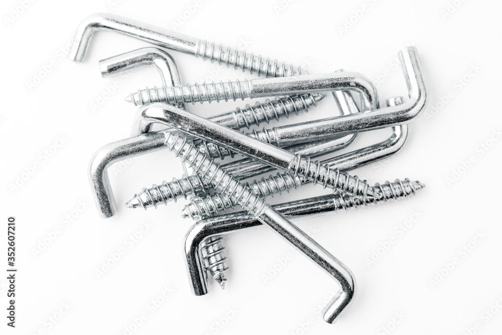 Metal hooks screws isolated on a white background. Concept of repair and construction
