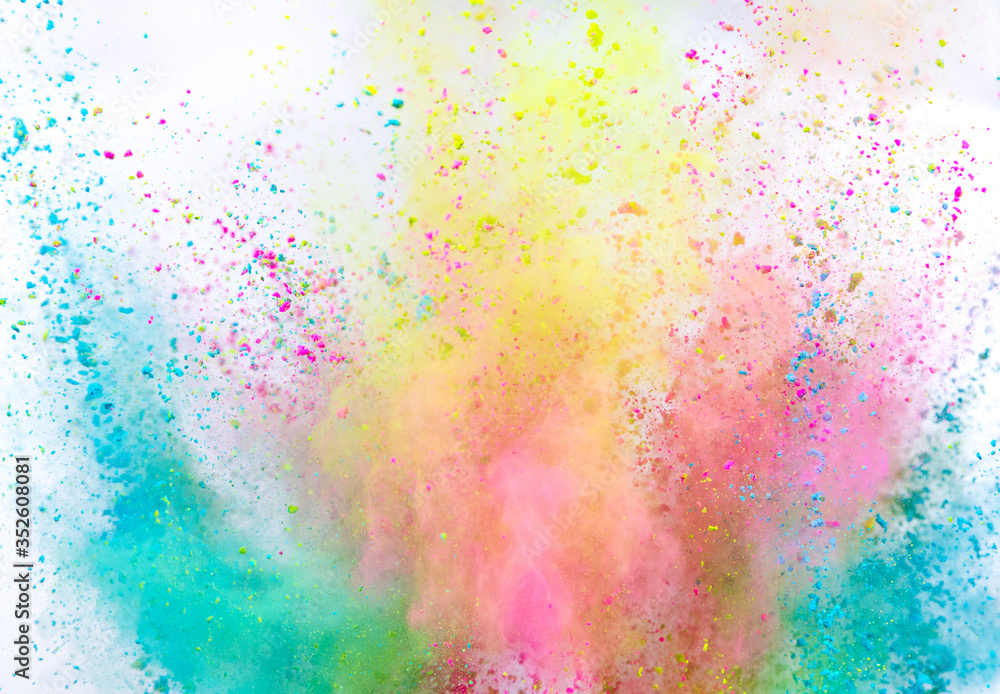 Launched colorful powder on white background, freeze motion
