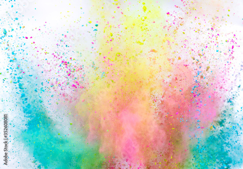 Launched colorful powder on white background  freeze motion