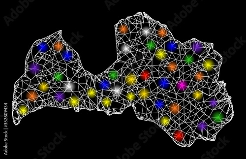 Web mesh vector map of Latvia with glare effect on a black background. Abstract lines, light spots and spheric points form map of Latvia constellation.