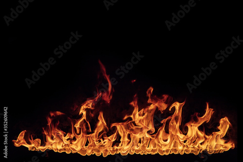 fire flames with sparks on a black background, close-up