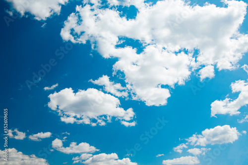  Use for the background. White shaggy clouds on a blue sky. There is a clean place for the inscription.