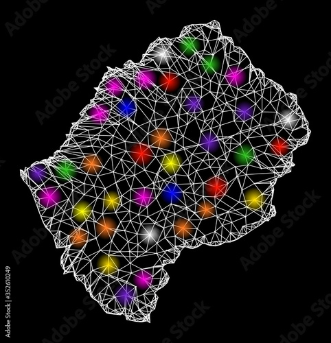 Web mesh vector map of Lesotho with glare effect on a black background. Abstract lines, light spots and spheric points form map of Lesotho constellation. photo