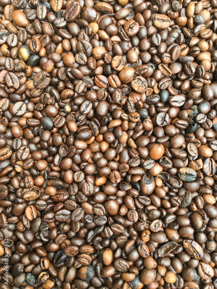 large roasted coffee grains, background texture from coffee beans large roasted coffee grains, background texture from coffee beans
