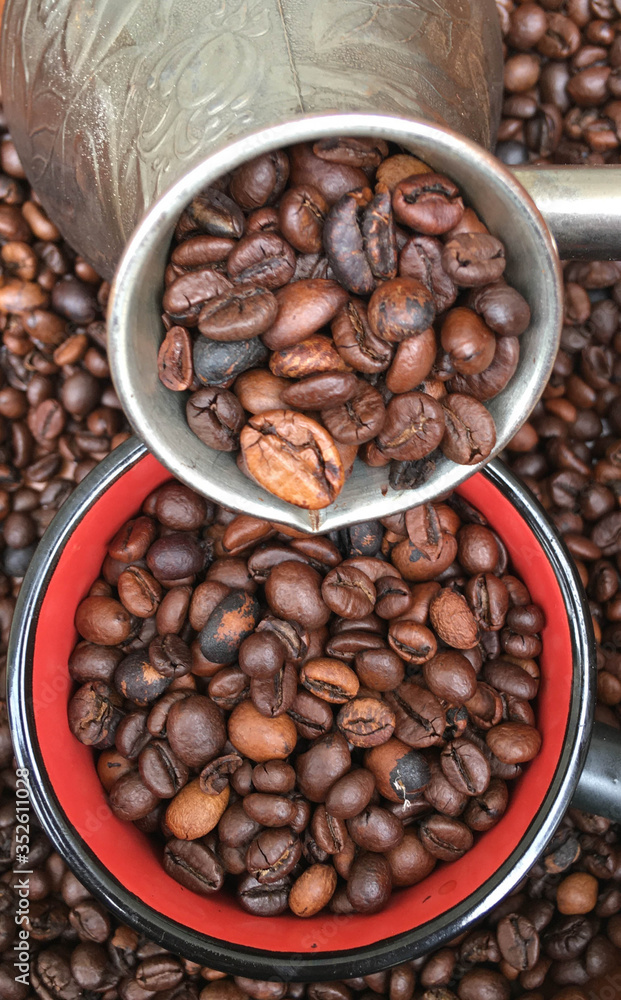 Fototapeta premium full turk of roasted large coffee beans, coffee beans texture background