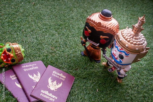 Ravana and giantess  Standing staring at Hanuman sleep side next to passport.