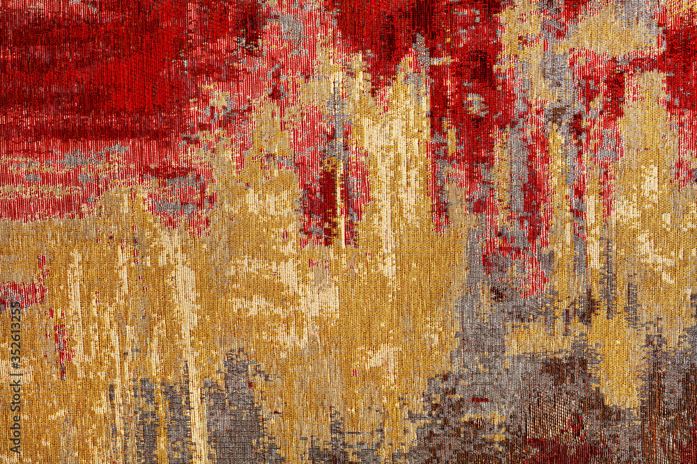 Abstract red and gold textile carpet pattern of oriental style.