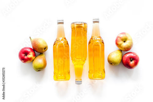 Set of beer bottles with apple, pears, wheat top-down