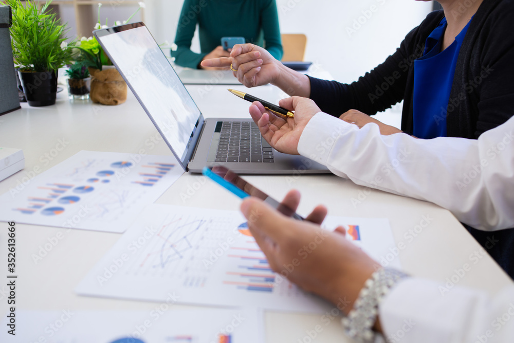 team of businessmen are summarizing the profits of the company to make bonuses for employees. team of businessmen are summarizing the profits of the company to make bonuses for employees.