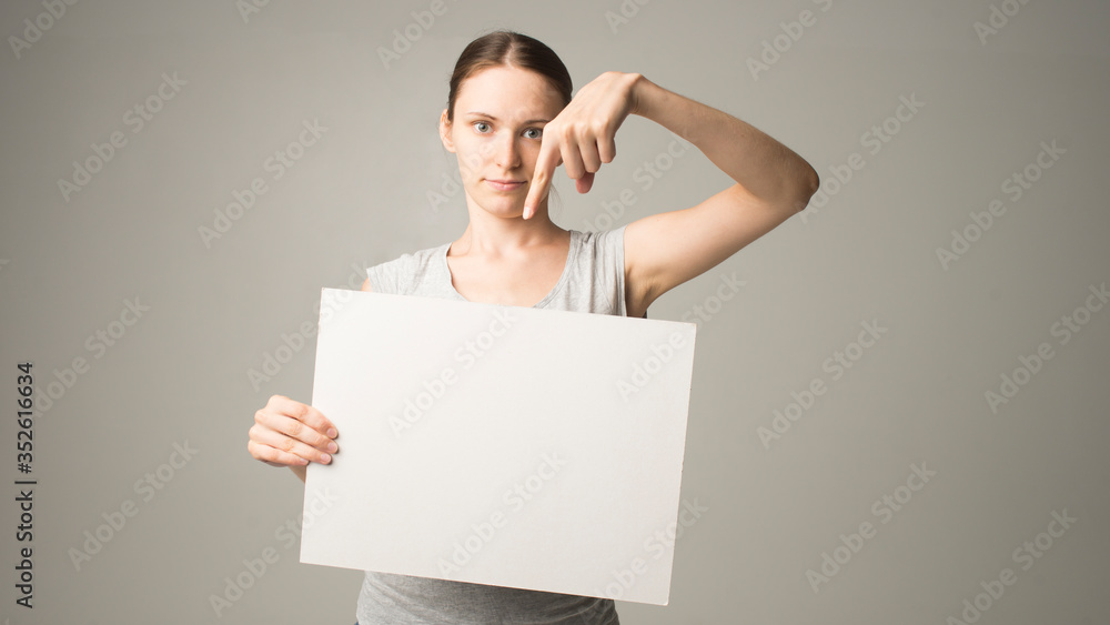 woman holding a sheet of paper in her hand woman holding a sheet of paper in her hand