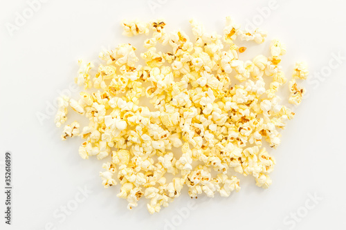 Popcorn scattered on white background top view