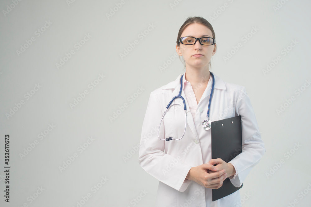 Portrait of an attractive young female doctor in white coat. Portrait of an attractive young female doctor in white coat.