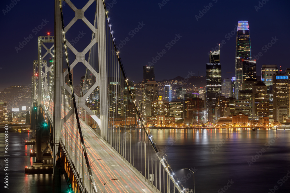 San Francisco Bay Bridge and Waterfront at Night. Yerba Buena Island, San Francisco, California, USA.

