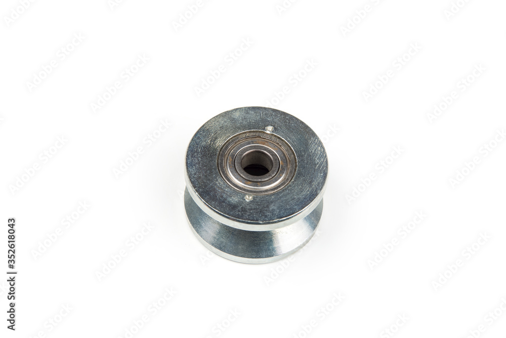 Heavy duty sliding wheel on bearings on a white Heavy duty sliding wheel on bearings on a white