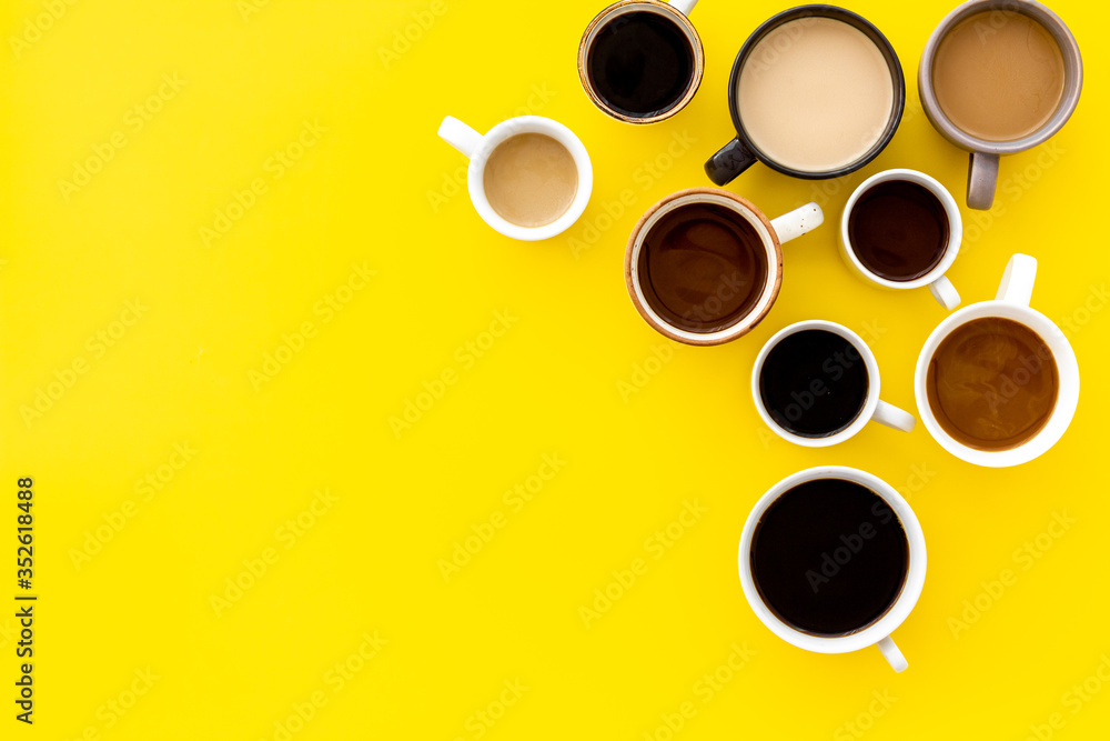 Lots of coffee on yellow table top view copy space Lots of coffee on yellow table top view copy space
